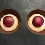 Chocolate dome, praline mousse and raspberry melting heart: The image is a representative of the step 19