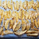 Baked wedges potatoes with spices and Parmesan: The image is a representative of the step 4