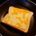 Grilled cheese with eggs and marbled cheddar: The image is a representative of the step 2