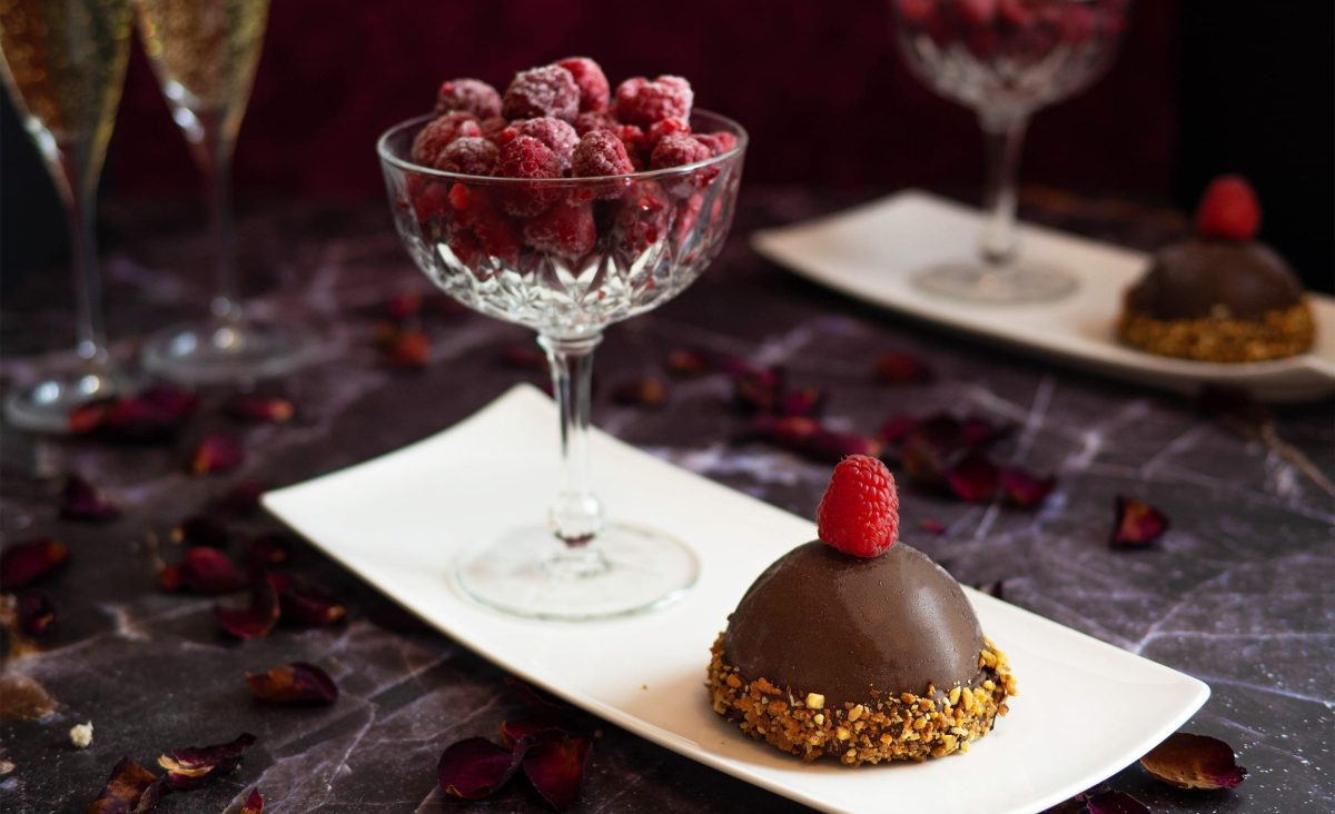 La photo représente la recette : Chocolate dome, praline mousse and raspberry melting heart