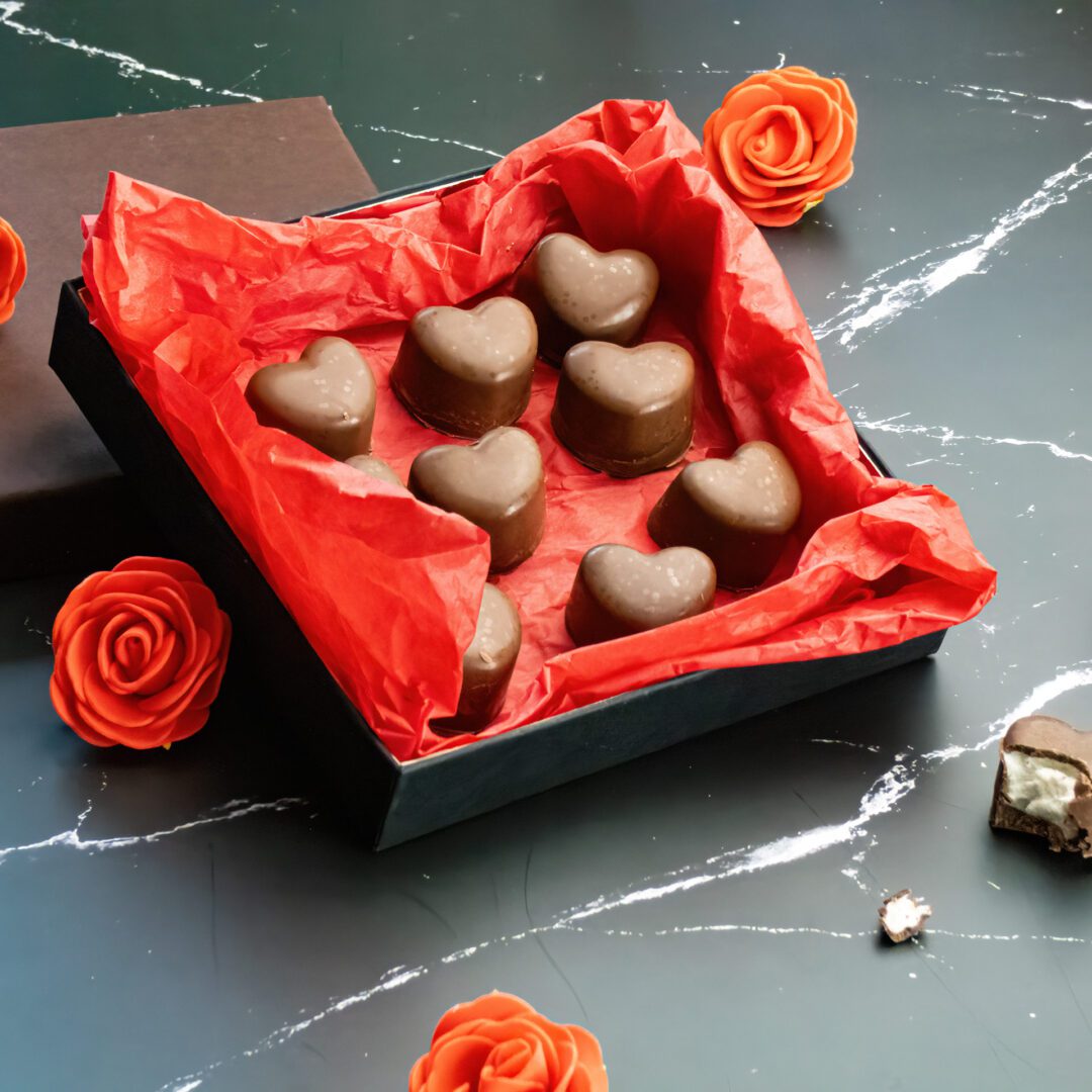 La photo représente la recette : Bonbons au chocolat et guimauve en forme de cœur