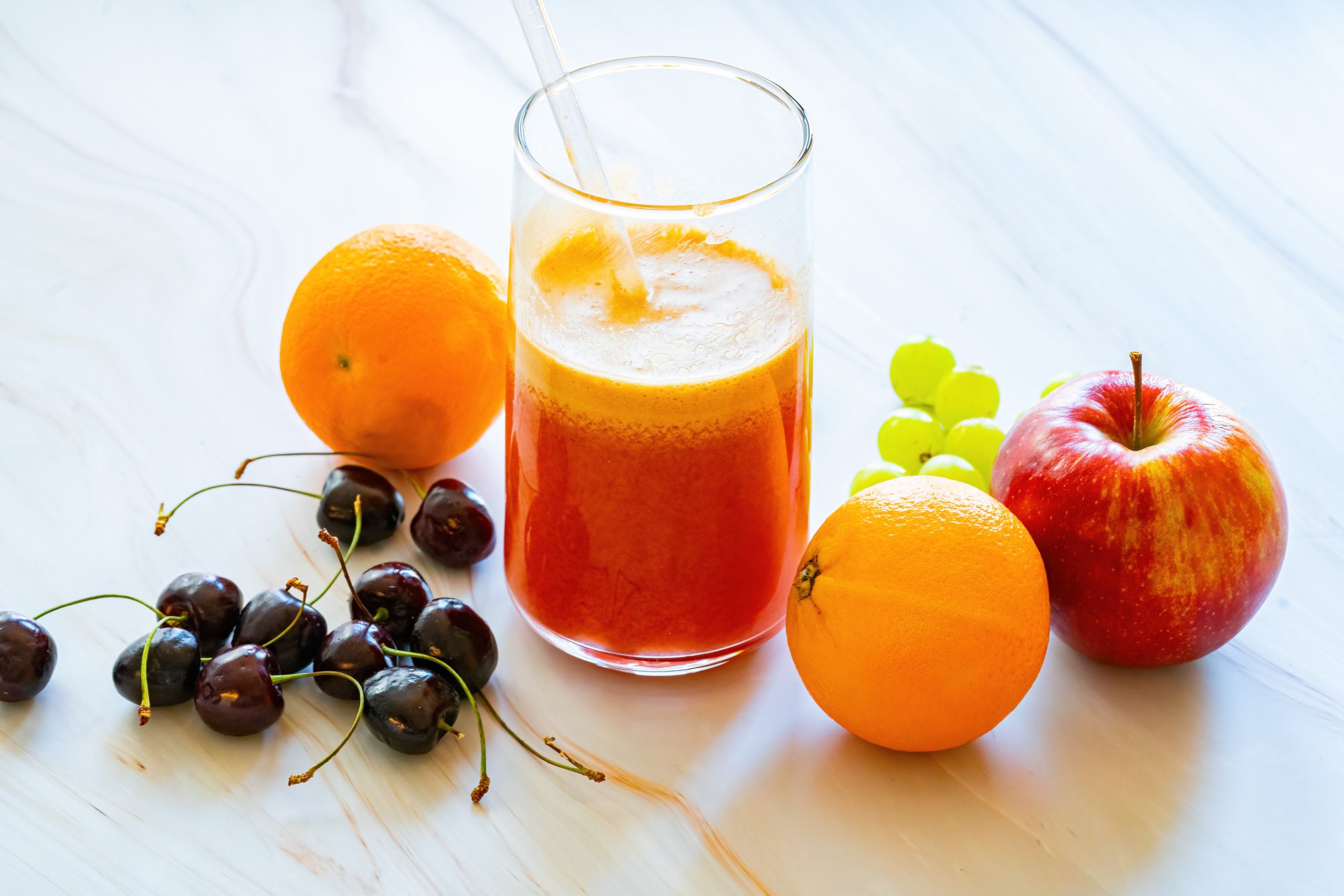 Fresh Fruit Juice Orange Apple Grape and Cherry