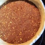 Flan pâtissier à la pistache avec croûte spéculoos-pistache et pâte brisée : La photo est une représentation de l'étape 6