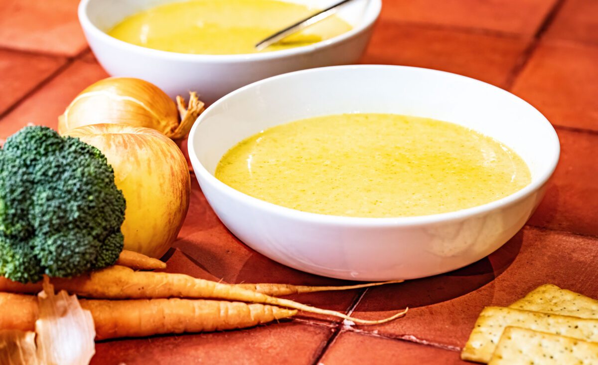 Creamy vegetable and apple soup with maple syrup, ginger, and cumin